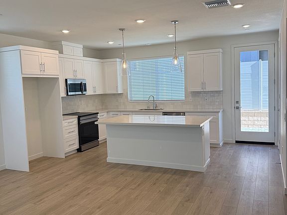 Brand new kitchen with quartz counter tops