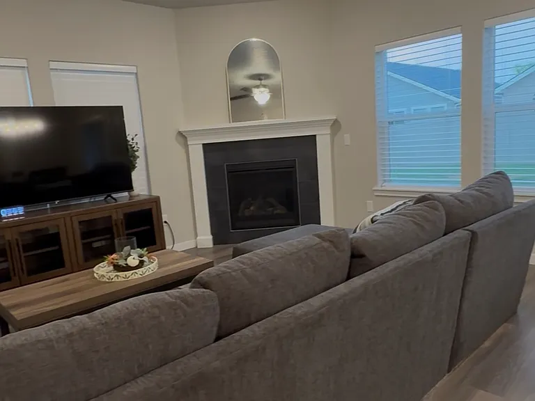 Spacious living room with plenty of natural light during the day.