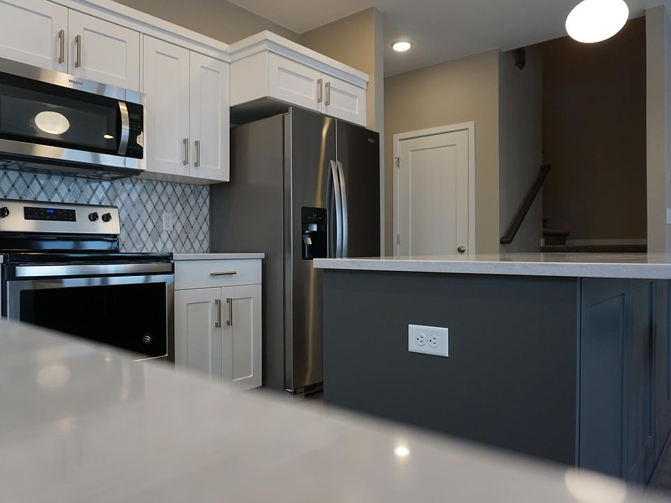 Stunning kitchen with quartz counter tops, stainless steel appliances, soft-close cabinets and more.