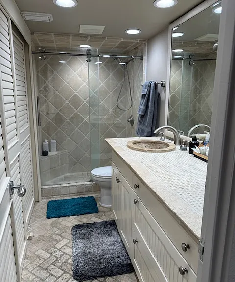 Bath with large shower.