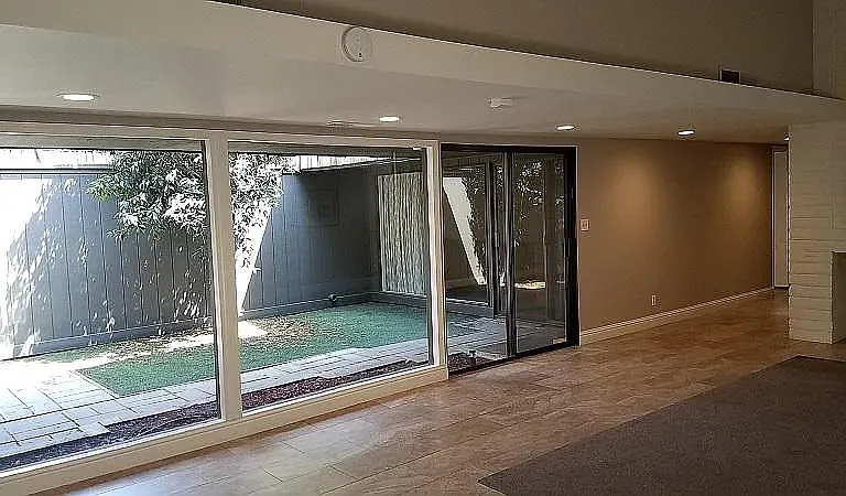 Beautiful lighten floorplan with marble tile and custom rugs.