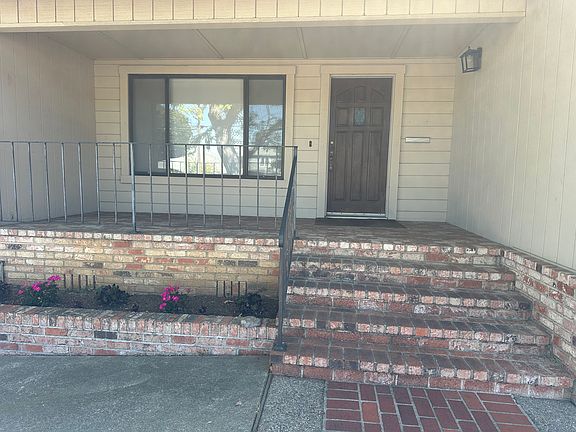 Large extended brick front porch.