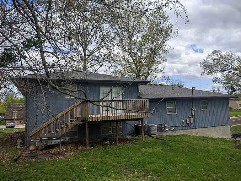 Back of House. The yard is shared with the tenant in Unit B. The deck is for your private use.