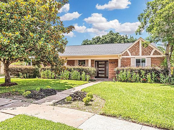 Stylish glass and wood front door with side light panels to welcome your guests. Roof replaced in 2019. Sprinkler system in front & back with 8 zones.