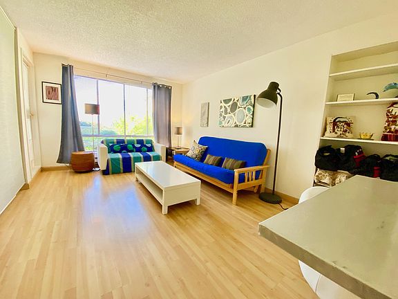 Large Living Room with Bay View and Futon Sofa