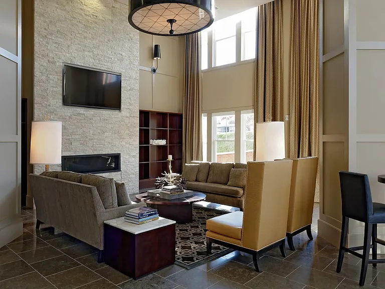 Lobby with lounge seating, fireplace and flat screen television