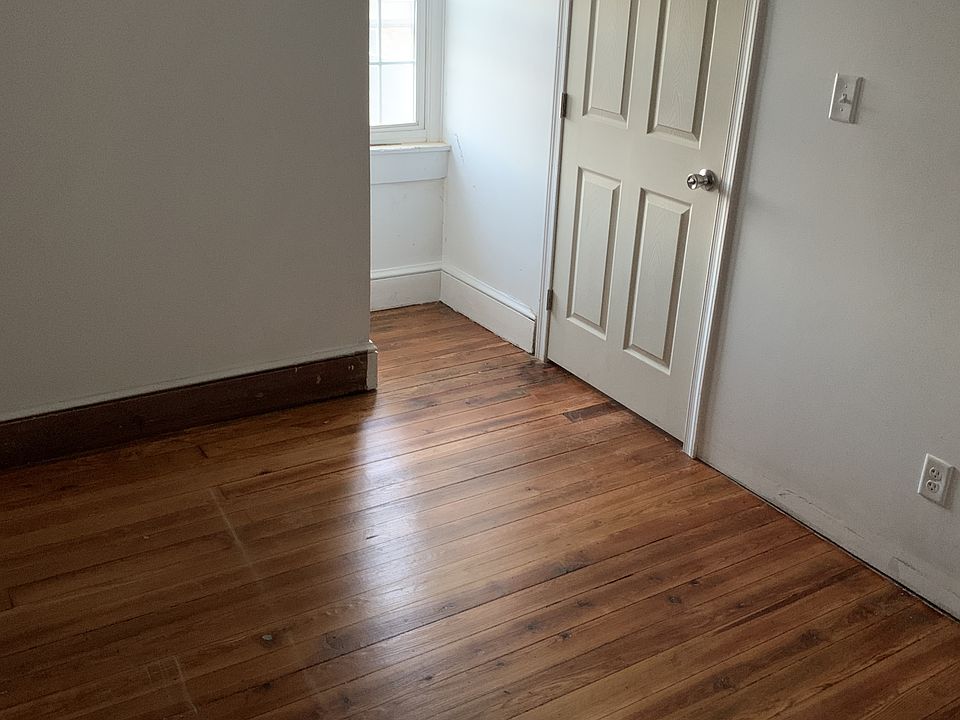 Bedroom with storage and hardwood floors