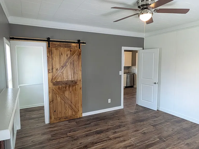 Back bedroom with fireplace.