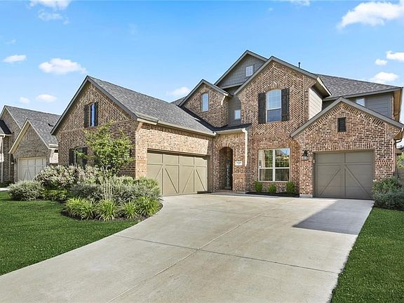 3 Car Garage and Gorgeous Extended Front Landscaping Beds