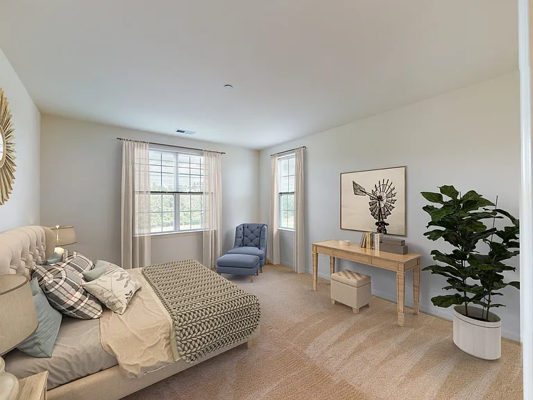 Step into luxury living at Eastampton Village Center. This spacious bedroom features modern decor, large windows for natural light, and elegant finishes. Enhance your lifestyle todaycontact us to learn more about available units!