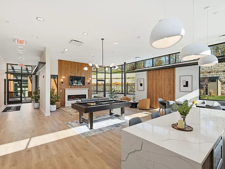 Elevate your lifestyle at Eagle Rock Apartments at Woodbury with this stylish and airy interior. Enjoy modern amenities, abundant natural light, and a welcoming atmosphere. Schedule your visit today and see the difference!
