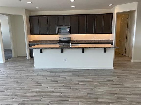 Large Kitchen Island with up lighting under cabinets