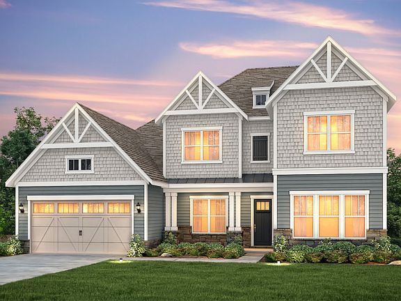 Woodfield Exterior 5 features stone, shakes, siding and covered front porch