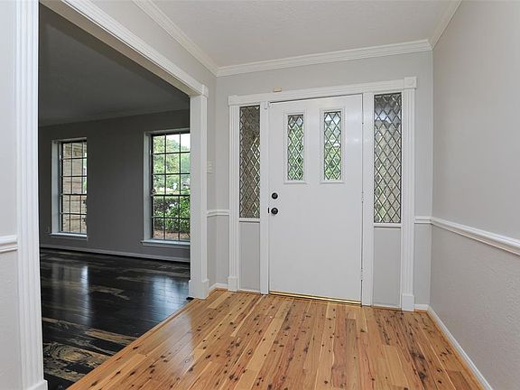 Front entry with formal living and dining room in view.