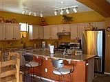 full kitchen with island & stainless steel appliances