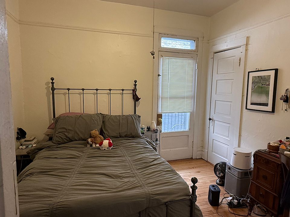 bedroom #3 -- approx 10'x11' with medium closet and access to private balcony