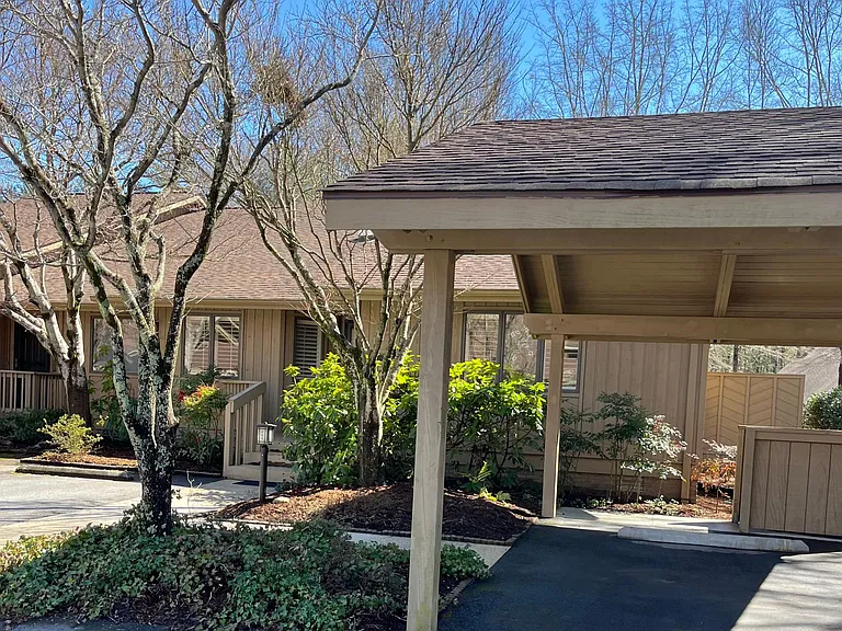 Two parking spaces. One under a carport. Landscaping and lawn is cared for by HOA.