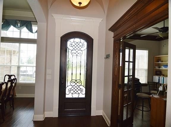 IRON DOOR,GLASS OPENS LEADING TO THE ENTRY