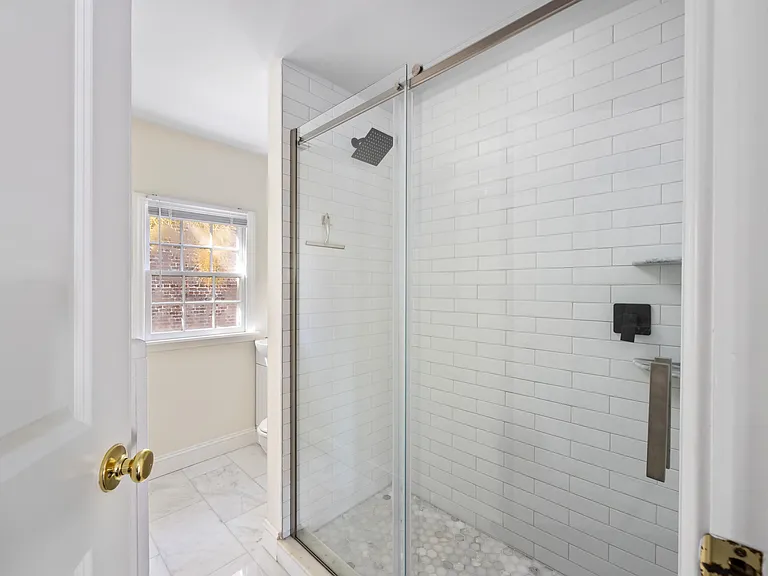 1st bathroom includes tiled shower