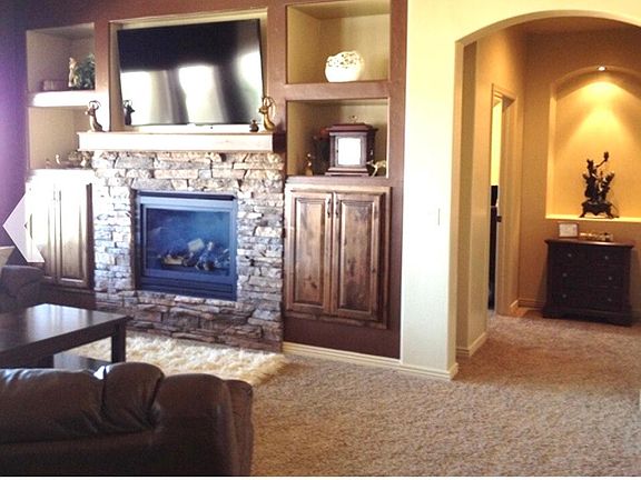Living room with gas fireplace.