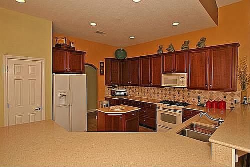 Kitchen w/ Island & Silestone Countertops