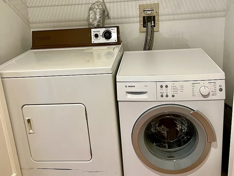Hallway in-unit washer and dryer.