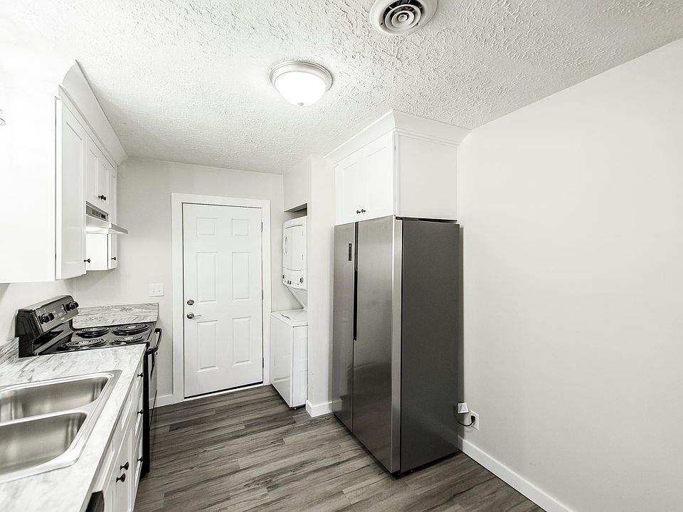 Eat-in kitchen and back door from beside doorway to living room