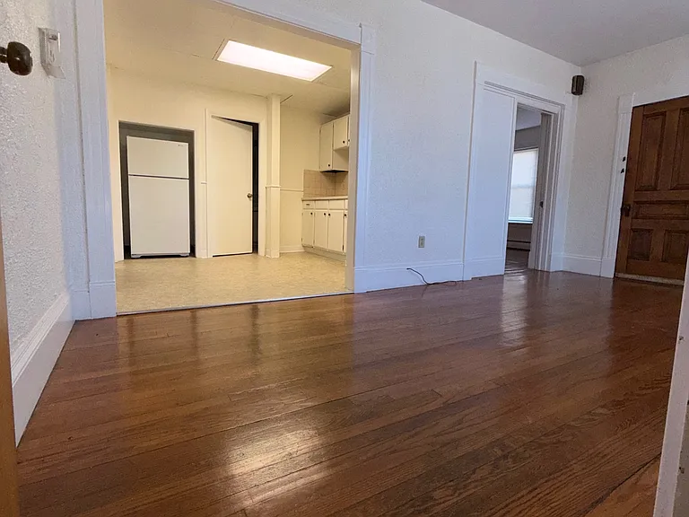 Large Living Room with hardwood floors and plenty of sunlight.