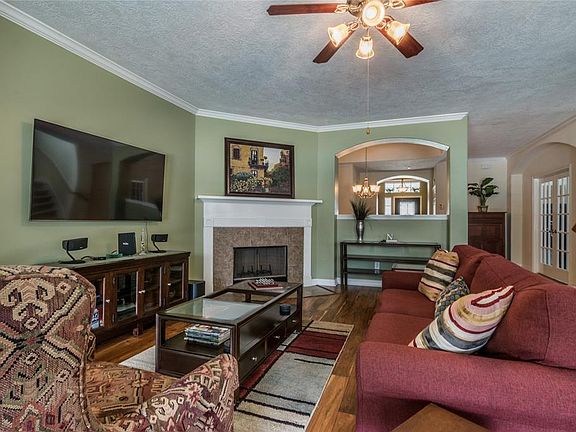 Family room with cozy wood burning fireplace with gas starter.