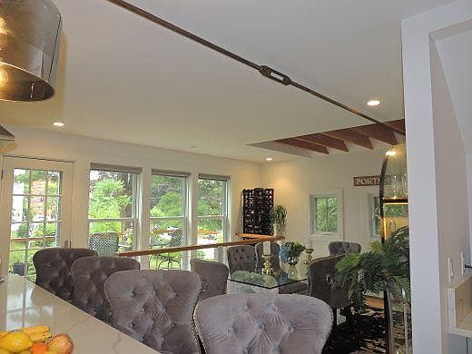 View from kitchen overlooking dining and gardens.