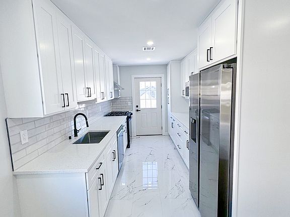 Kitchen with door to outdoor large deck