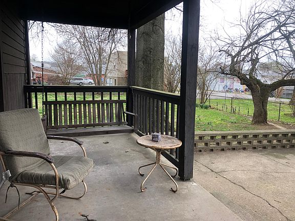The back porch is of of the kitchen with a large patio.