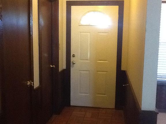 Front entrance, door to garage, closet
