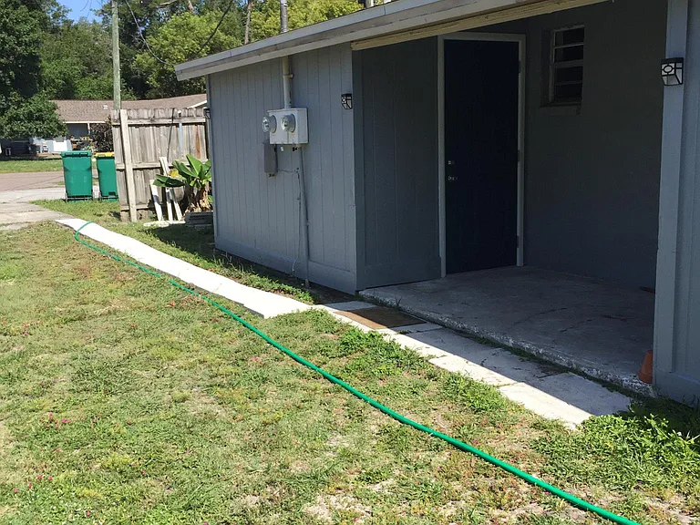 Rear entry to the laundry room.