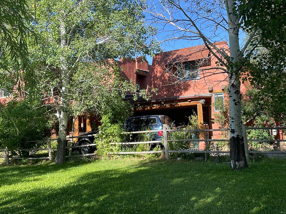 Looking at the back of the property from the green space