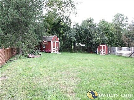 YARD WITH TWO SHEDS