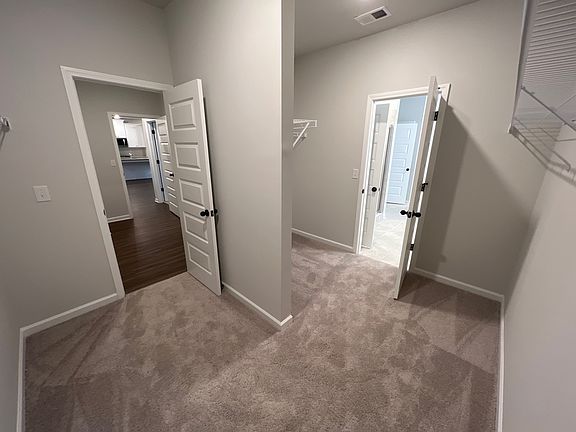 Owners suite walk in closet (when first purchased) The closet has been updated with a modular closet built into the wall