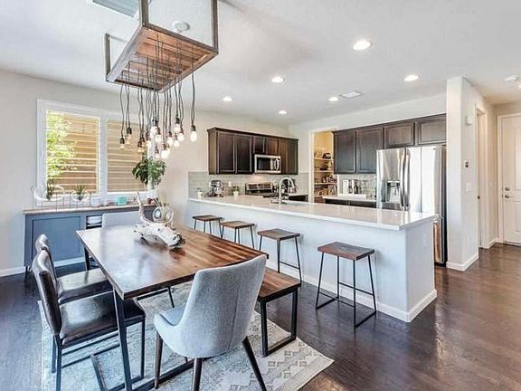 Dining room with custom chandelier.