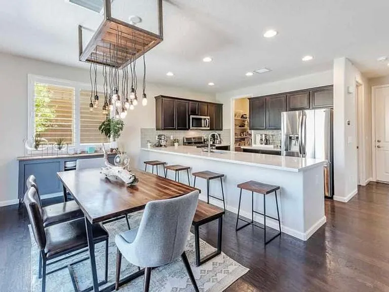 Dining room with custom chandelier.