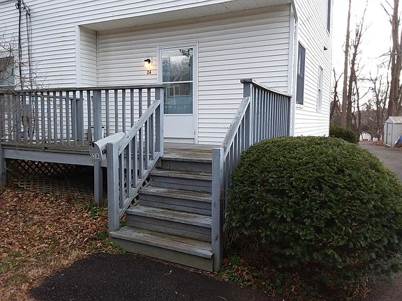 Private deck and entrance to 2A Leahey Ave. Side windows on the right are living area and kitchen windows.