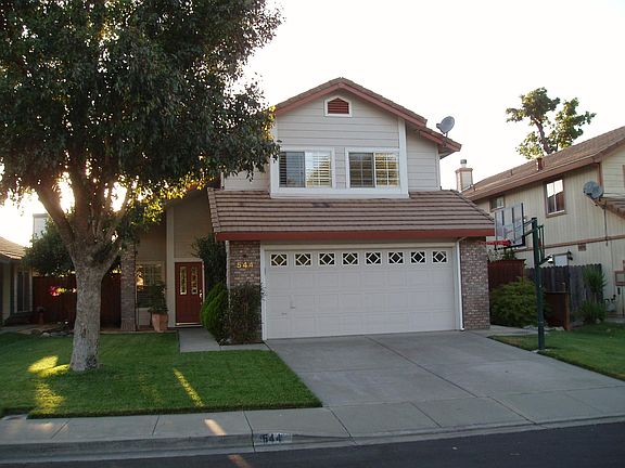 Front of home backs up to Nut Tree Rd.