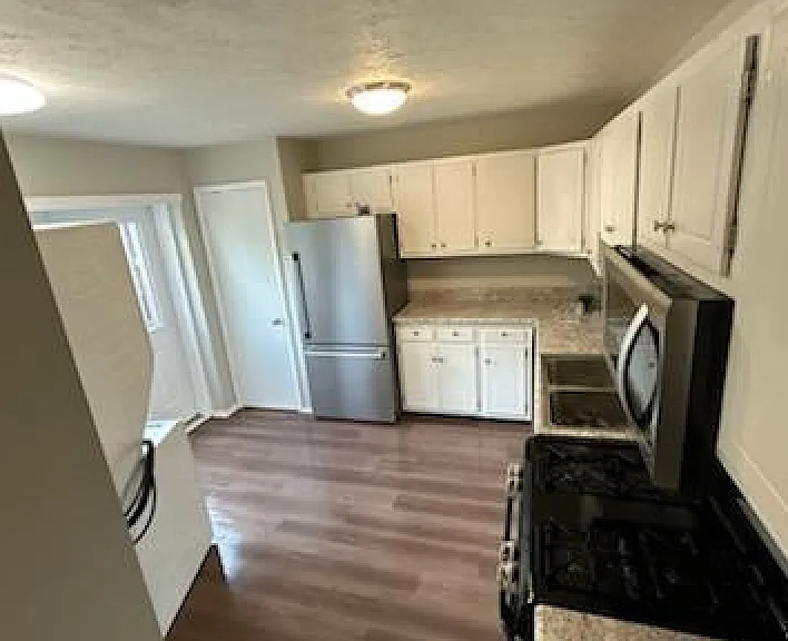 Kitchen has new flooring and appliances less than a year old