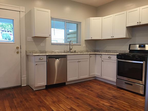 Kitchen including gas range and dishwasher