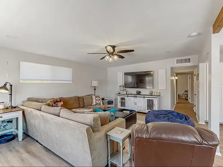 Living Room with Desk behind couch.