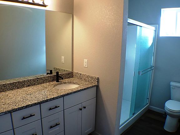 Master Bathroom with granite counters and shower