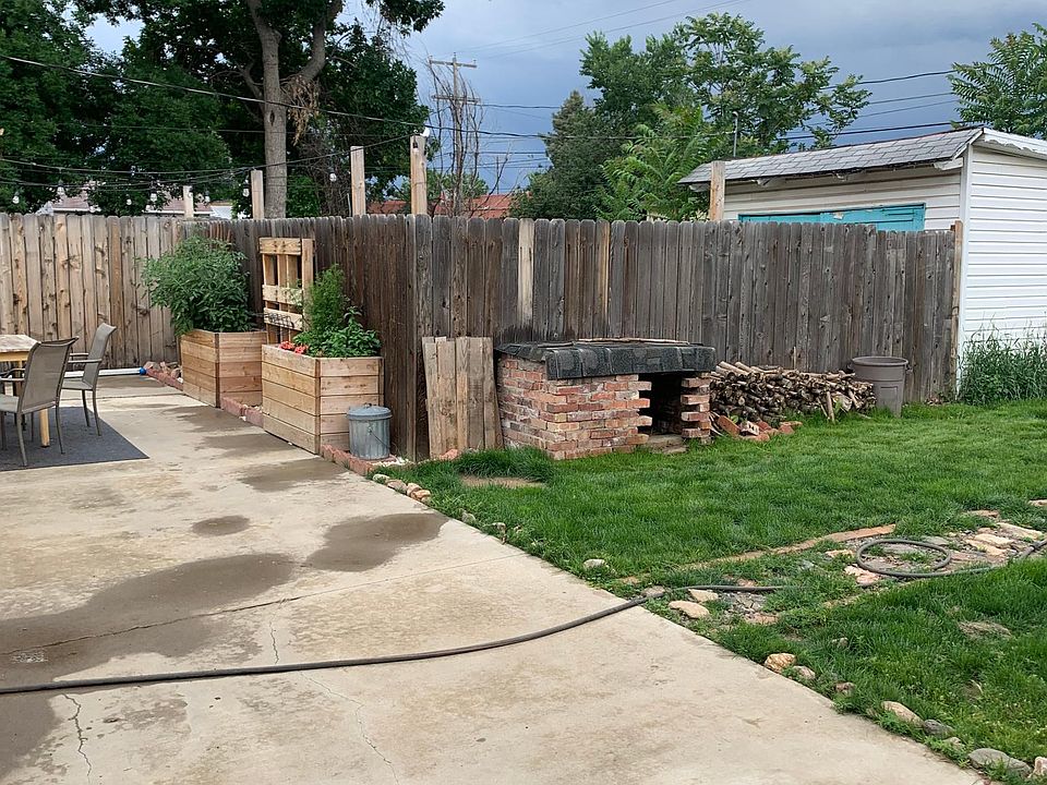 Looking across the 550sf concrete patio towards the multiple of built in planter boxes