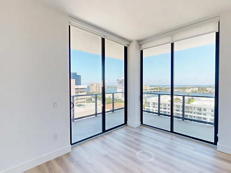 Apartment Living Room with wood flooring and Balcony.