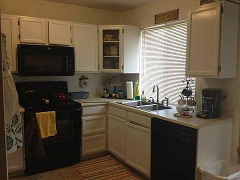 Kitchen with brand new stainless steel refrigerator