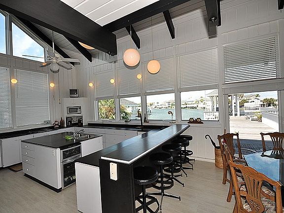  Not every home needs granite counter tops.  The black laminate blends in perfectly with the finishes of the home.  However, if you need the granite and stainless appliances the price allows for these upgrades and is of course negotiable.