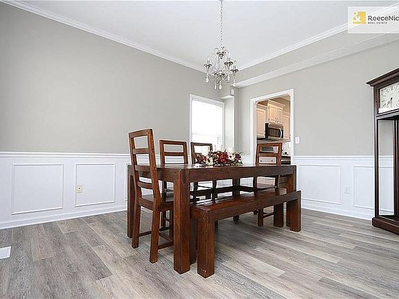 Formal dining room. New light fixture, great size for any size dining table or could be made into a home office!
